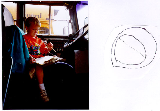 boy drawing a steering wheel