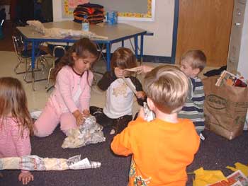 Students worked together to form the base of the mountain and a llama out of papier-mâché. 