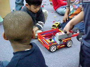 Figure 3. Kindergartners build using Lego-Logo with yellow RCX and gray battery box.