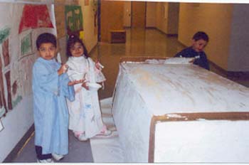 Figure 11. The children finished painting the back of the truck. 