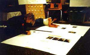 Figure 16. Lolita and Lexi studying photos and sketches of a wheel.