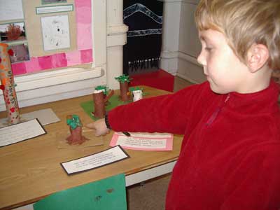 Figure 40. Child showing his model of a tree. 