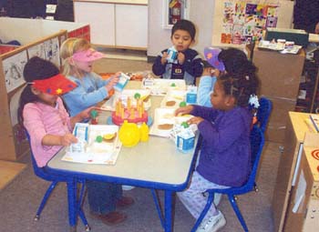 Figure 55. The children role-played eating lunch. 