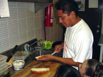Figure 34. A cook at Stella Market prepared sandwiches. 