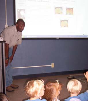 Figure 28. A hurricane expert answers the children's questions about hurricanes.