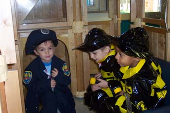 Figure 35. Children pretend to be police officers and firefighters.