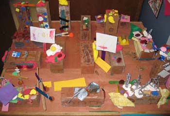 Figure 55. The children added McDonalds' signs, turtles, cars, street signs, and grass to the city.