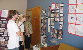 Figure 62. Parents and other visitors view the display of the project.